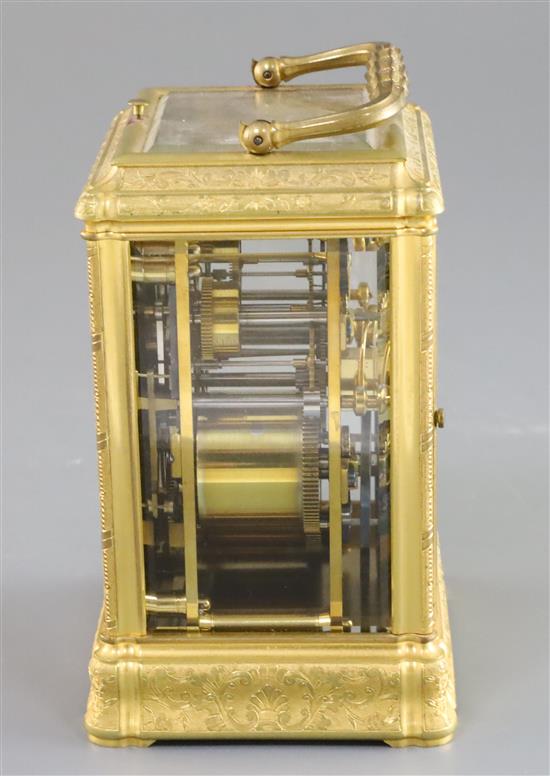 A late 19th century French ormolu quarter repeating carriage alarum clock, 5.75in., with leather travelling case